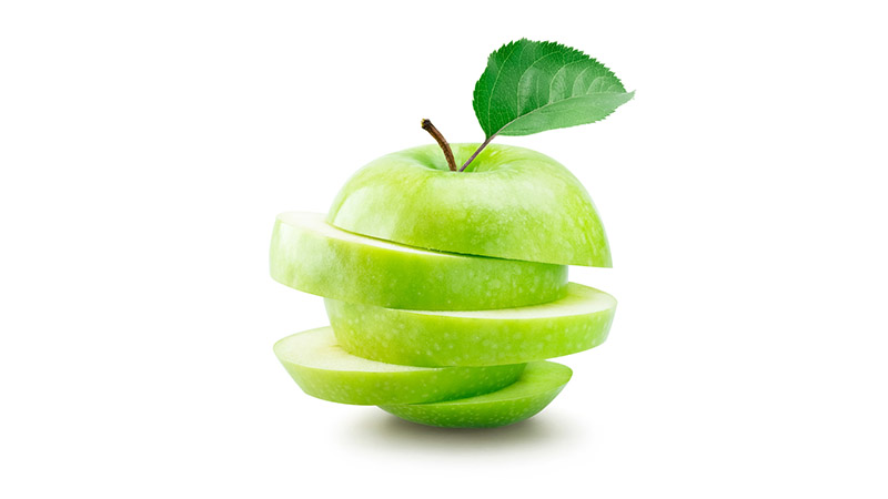 A sliced green apple