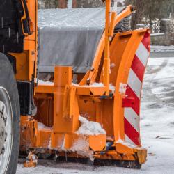 Snow plow working on a winter day