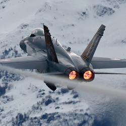 Fighter jet with snowy mountains in background