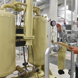 Compressed air tanks and worker