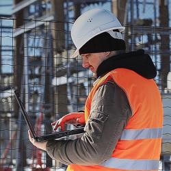 Vaisala technical engineer checking a transformer